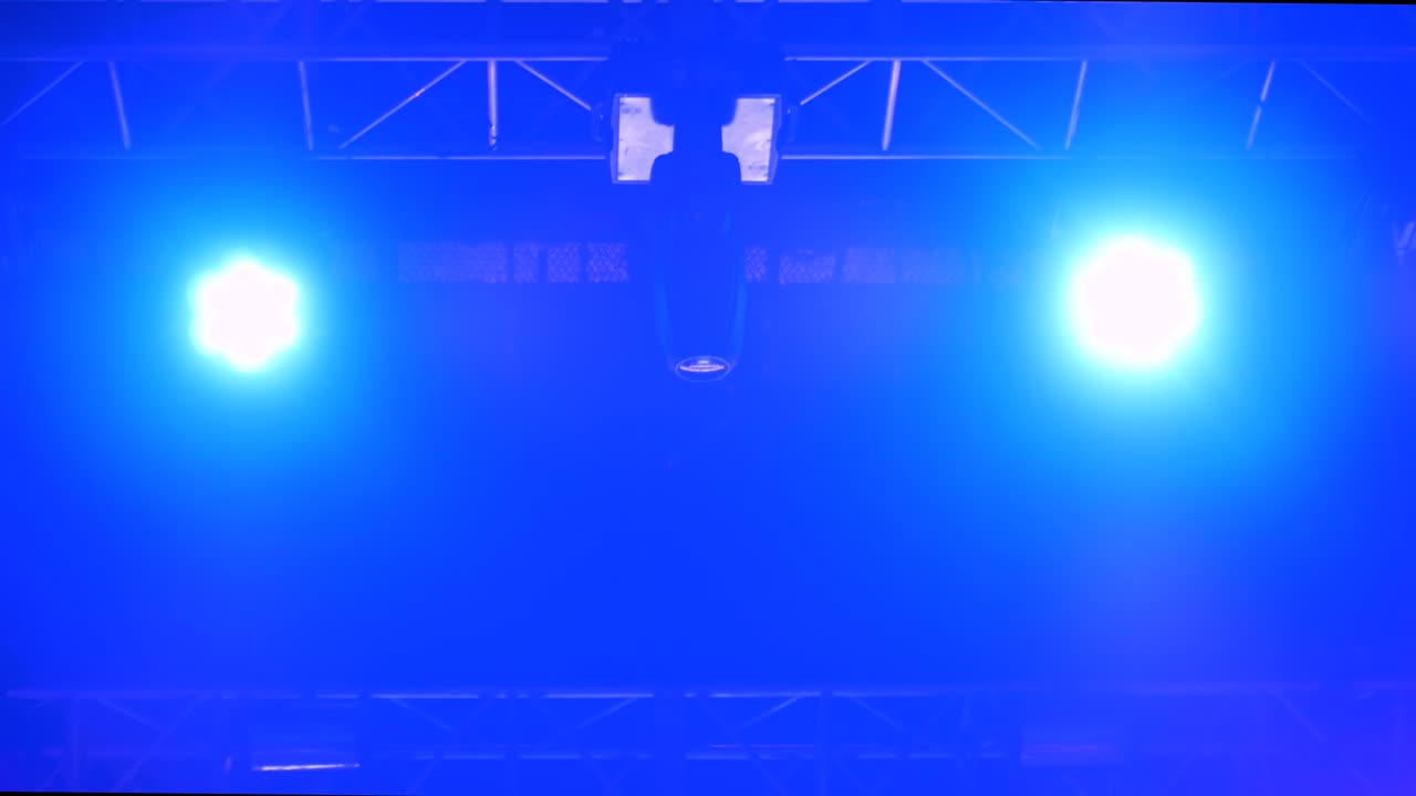 Colorful bright concert lighting equipment for stage at nightclub