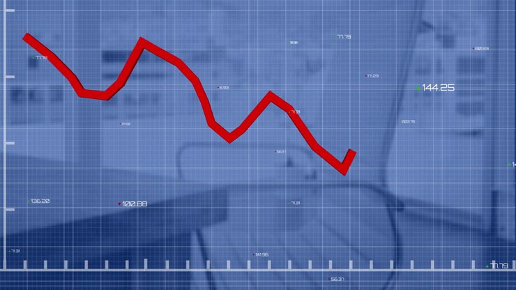 Animazione di un grafico rosso con numeri che cambiano su un motivo a griglia, su una scrivania e una sedia vuota.