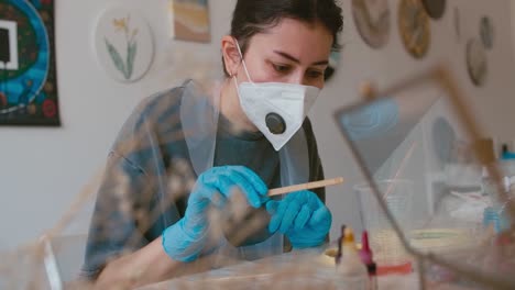 woman craftsperson working in art studio