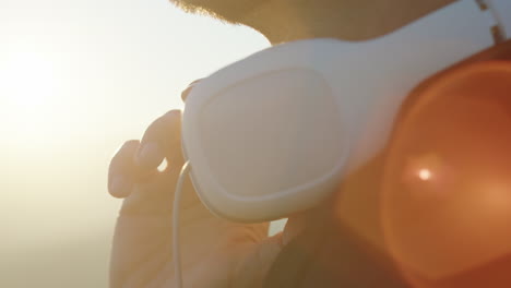 headphones around a man's neck