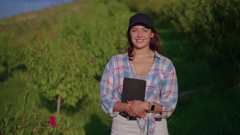 woman farmer in a peach orchard