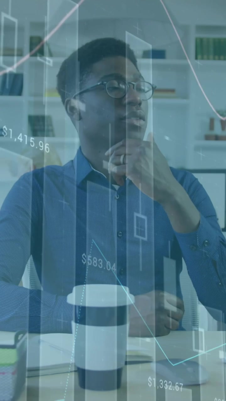 Animation of multiple graphs, changing numbers, thoughtful african american man looking at desktop