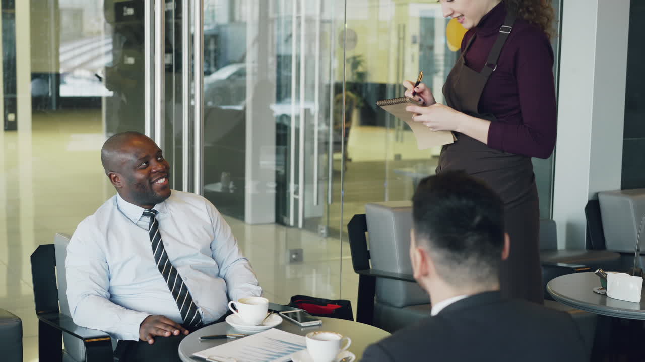Business Meeting in a Modern Cafe