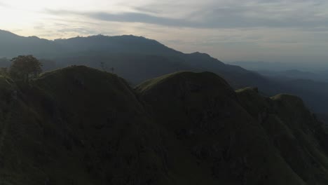 Cinematic-Drone-shot-of-a-mountain-in-the-sunrise-with-a-beautiful-skyline