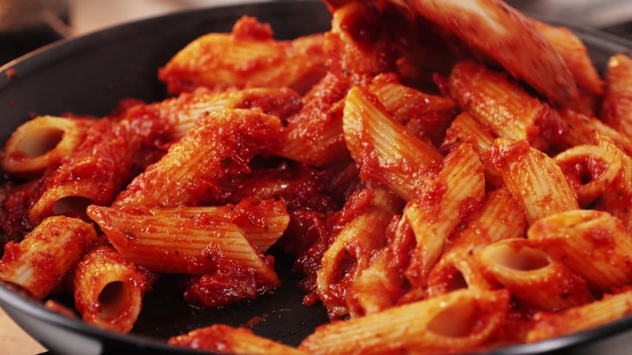 Cooking Penne Pasta with Tomato Sauce