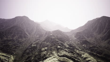 majestic mountain range bathed in soft sunlight during early morning hours
