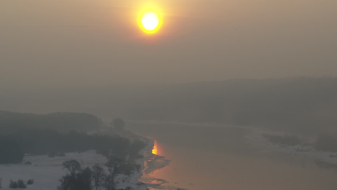 Aerial view of Lithuania nature in a misty sunrise. Cold winter morning