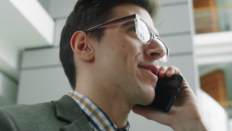 Young-Businessman-Having-Phone-Talk