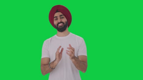 Happy-Sikh-Indian-man-clapping-and-appreciating-Green-screen