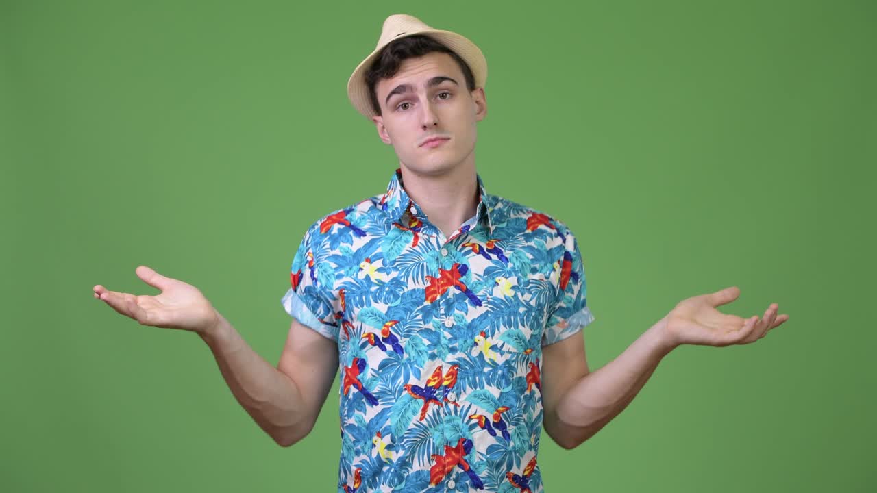 Young handsome tourist man choosing between left and right