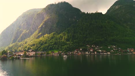 aerial view of hallstatt, austria, captured by drone, showcasing its picturesque lakeside homes, majestic mountains, and the unique charm of this enchanting alpine village