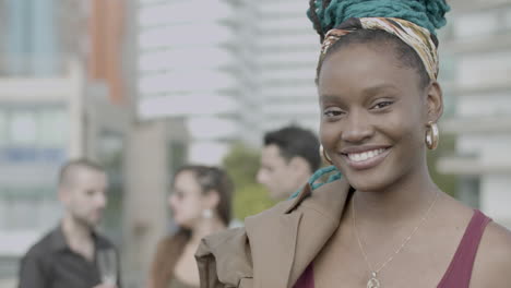 happy african american businesswoman looking at camera