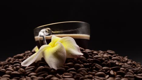 man take cup black coffee from roasted coffee beans background.