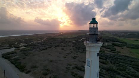 sunrise-aerial-lighthouse-in-Aruba,-California-lighthouse