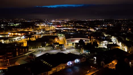 an aerial night time time-lapse, timelapse of fenton, in stoke on trent, staffordshire in the heart of the midlands, panning english cityscape, uk