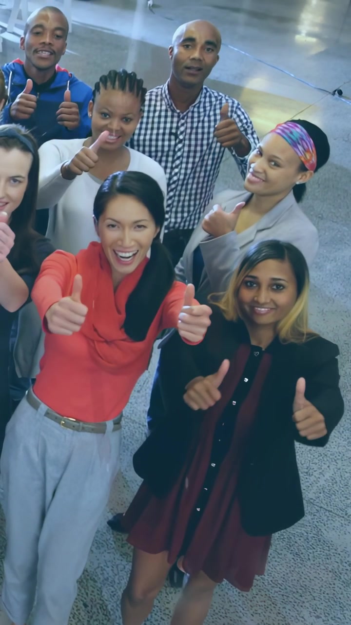 Vertical video: Team seeing camera, joining and giving thumbs-up under dotted overlay for marketing