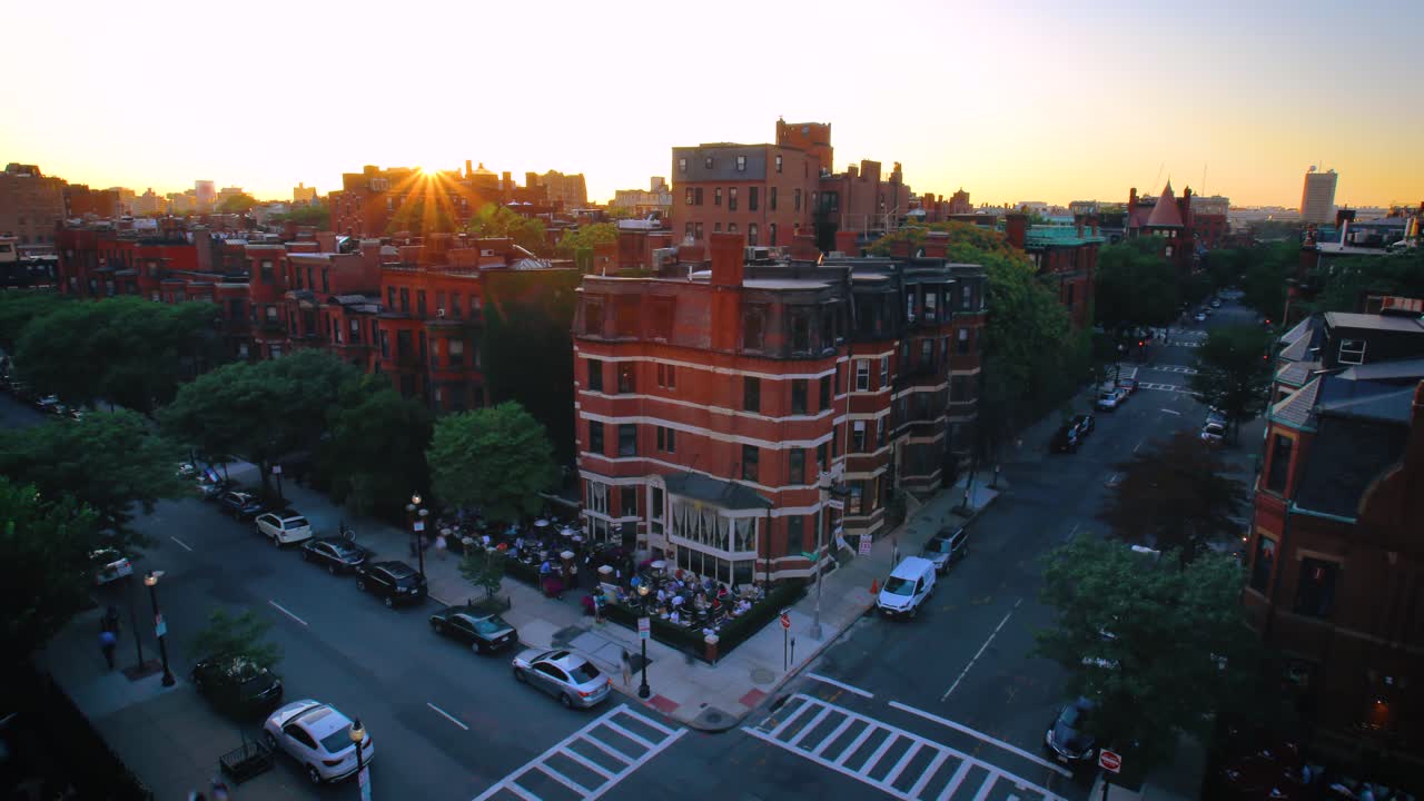 Rooftop sunset timelapse on Newbury street corner with cars driving by from day to night