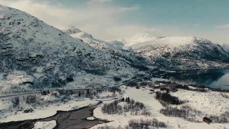 aerial view of road along the mountain range covered with snow during winter in lodingen, norway