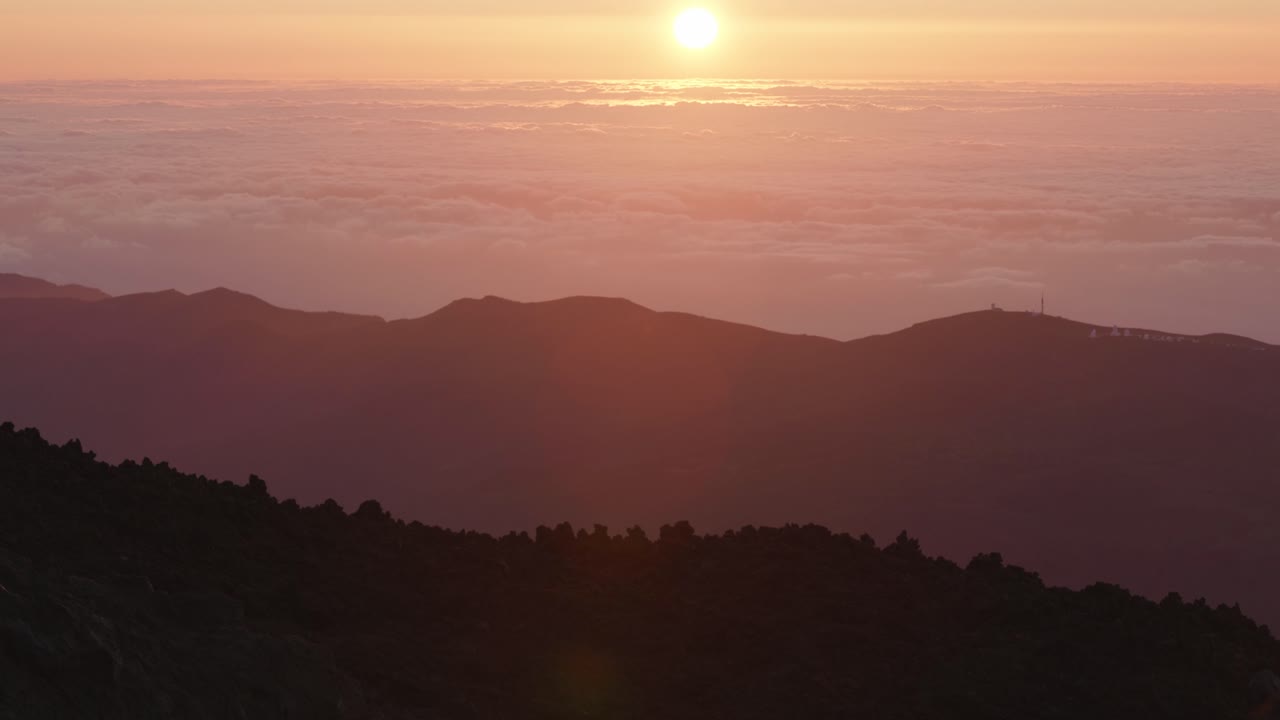 View of mountains and clouds during a sunrise from top of Teide volcano, Tenerife, Canary Islands, Spain,