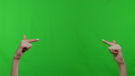 hands gesturing upwards on a green screen