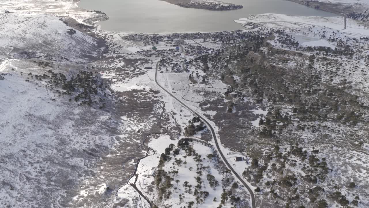 Aerial view of Caviahue snow-covered ski resort and lake in Neuquén, Argentina