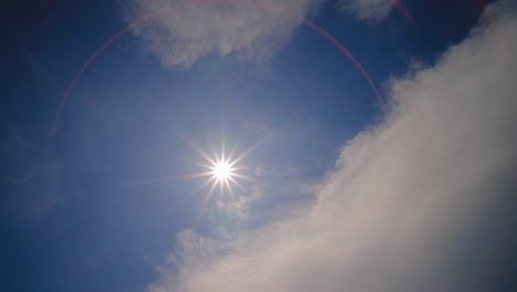 time lapse sun and clouds moving on sky with sun shines and sunbeams