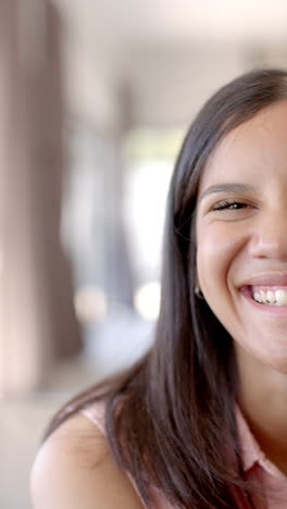 vertical video: smiling teenage girl enjoying time with friends, close-up portrait of happiness