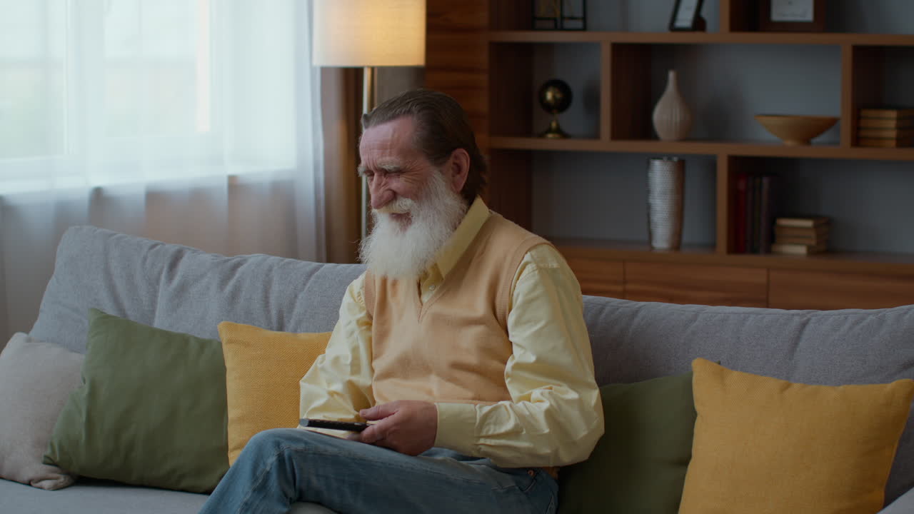 Elderly Man Watching Television