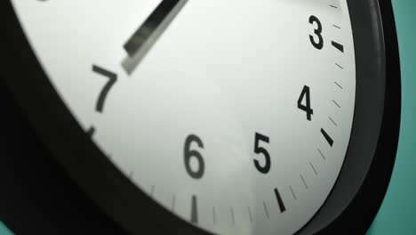 clock face on cyan blue aquamarine celadon sea-green wall in time lapse