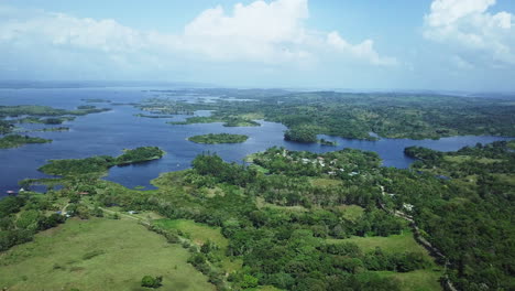 aerial view of green fields, trees, gatun lake on sunny day 2