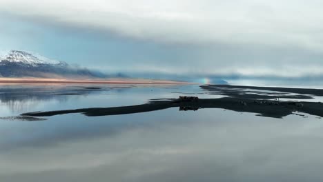 clear and still waters of south iceland - aerial shot