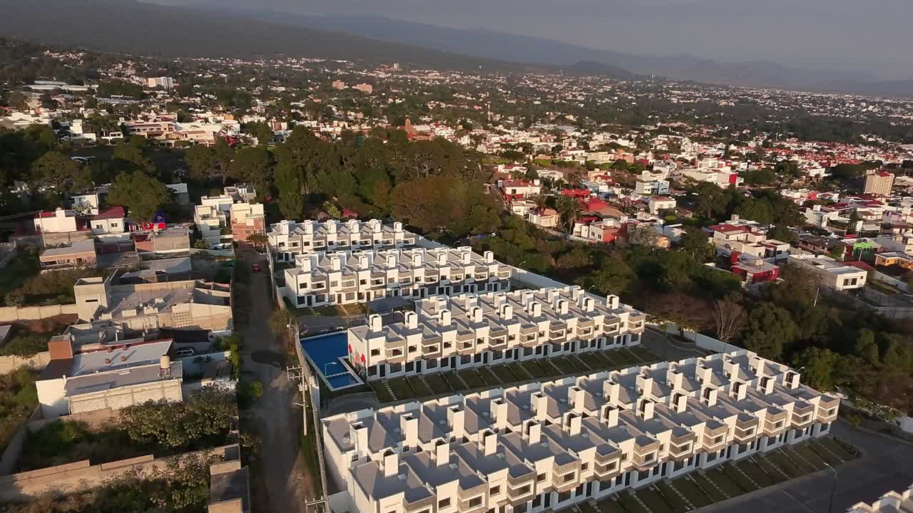 modern residential housing complex with uniform white townhouses in Cuernavaca, Mexico