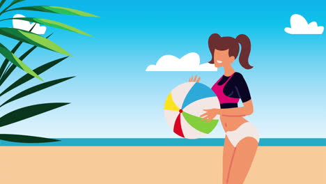 woman with beach ball on a sunny beach