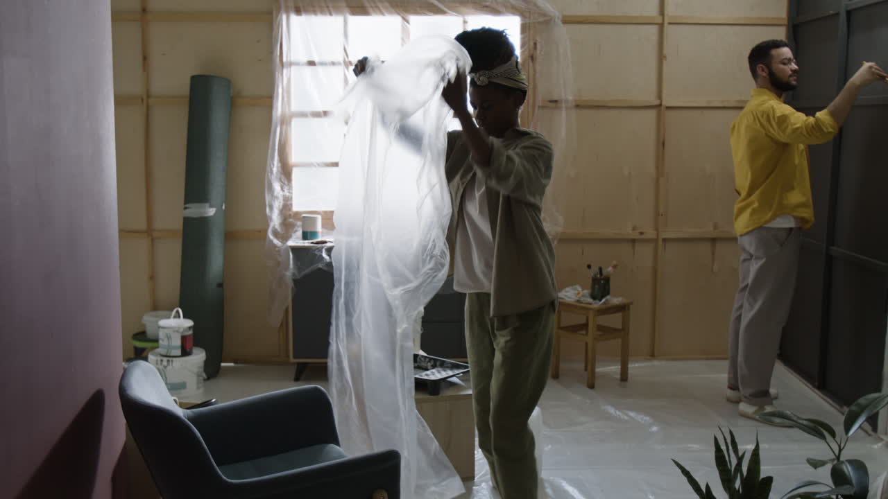 People painting a room