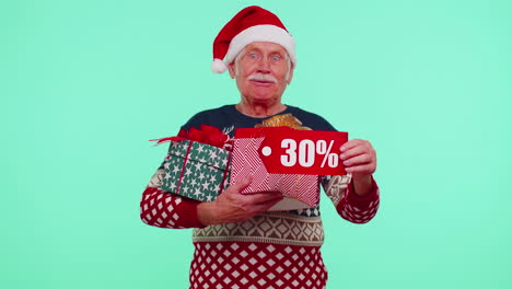 Senior-man-in-Christmas-sweater-showing-gift-box-and-30-Percent-discount-inscriptions-banner-text