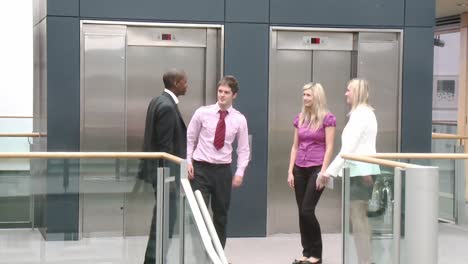 business team shaking hands in a building