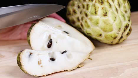 cutting a custard apple into slices