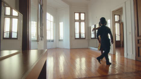 partners dancing argentine tango on a rehearsal at studio