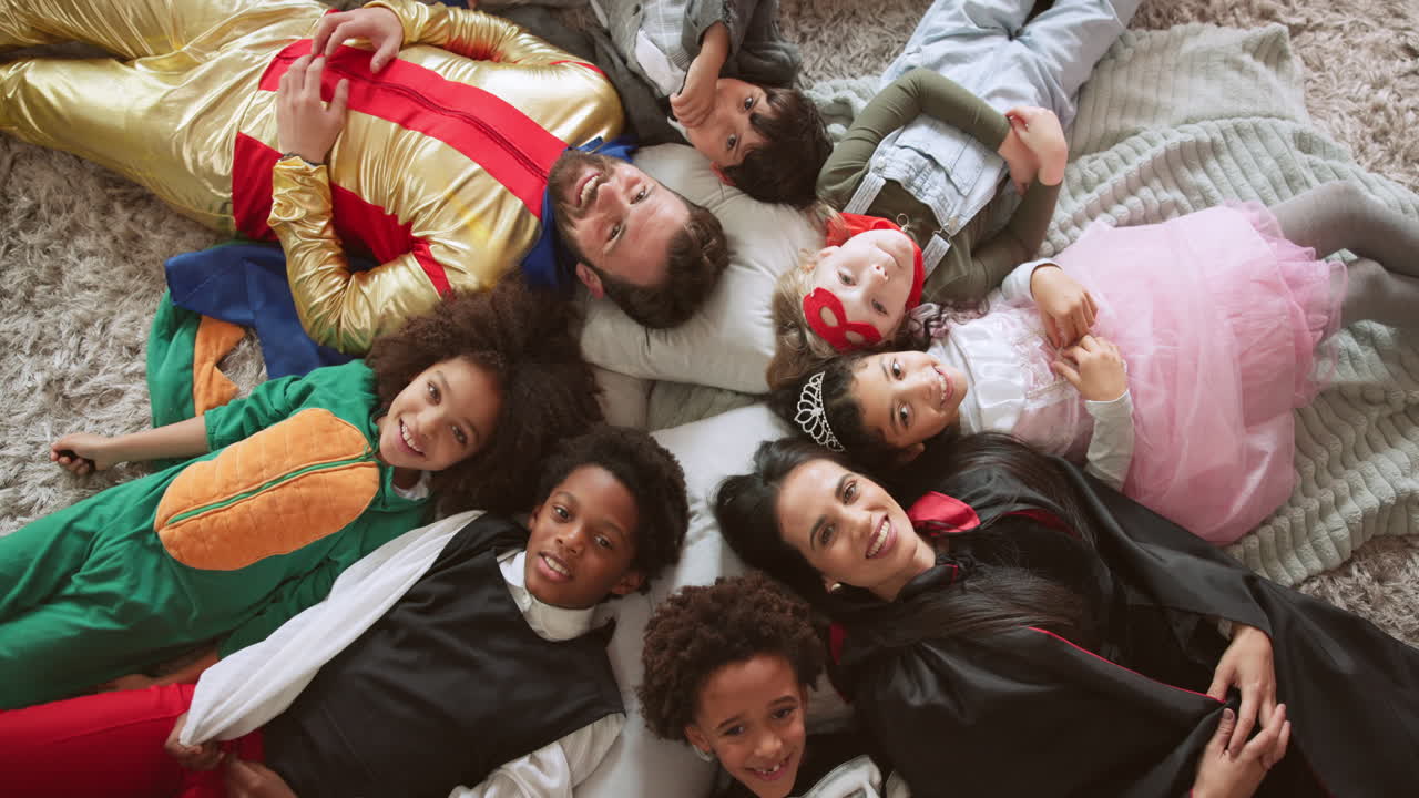 Family and Friends Celebrating Halloween in Costumes