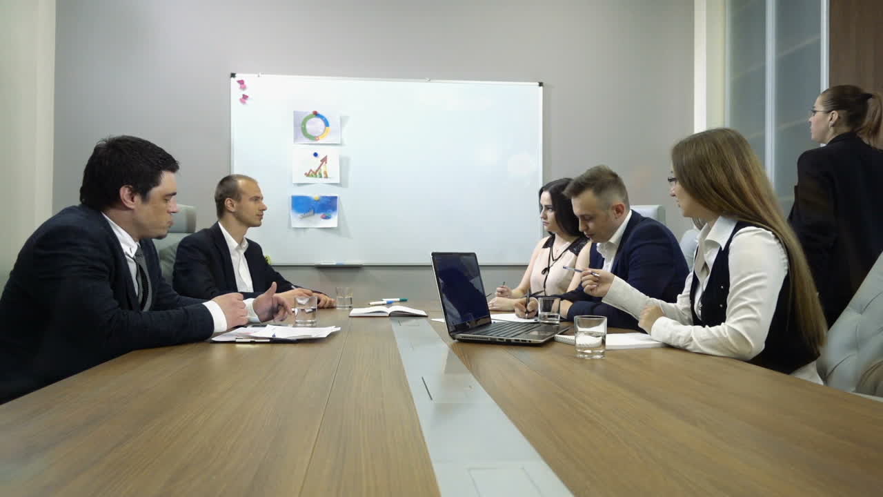 Business People Meeting Conference. Business partners discussing documents and ideas