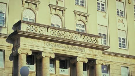 historic gradska kavana building façade in zagreb, featuring columns and architectural details