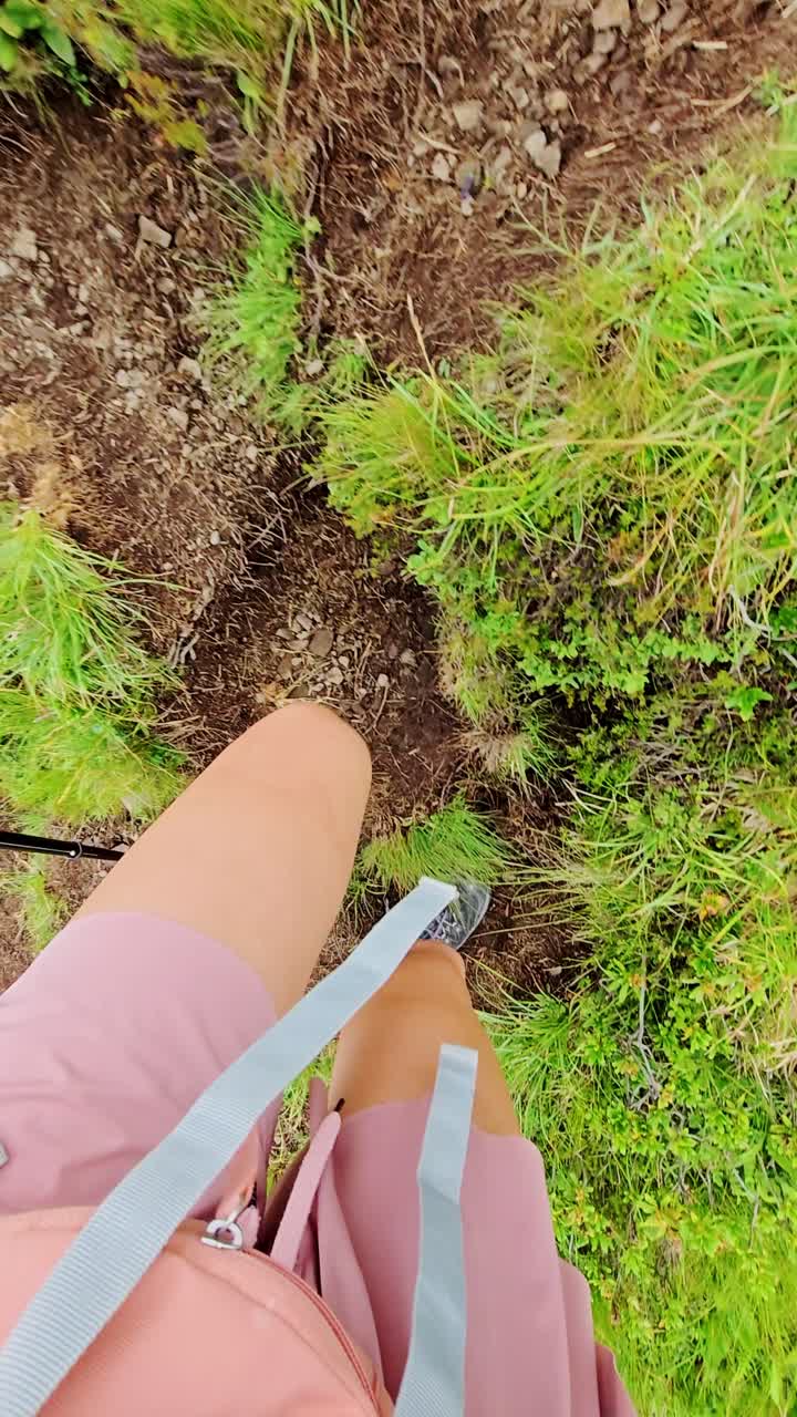 POV of woman hiker climbing rugged Dolomite trail symbolizing courage and ascent