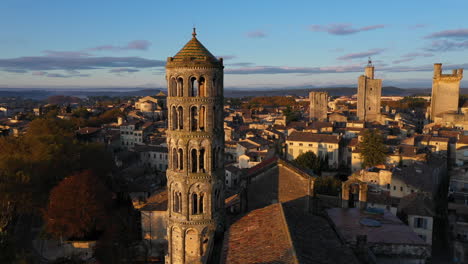 saint-théodorit cathedral and its fenestrelle tower aerial flight during sunrise