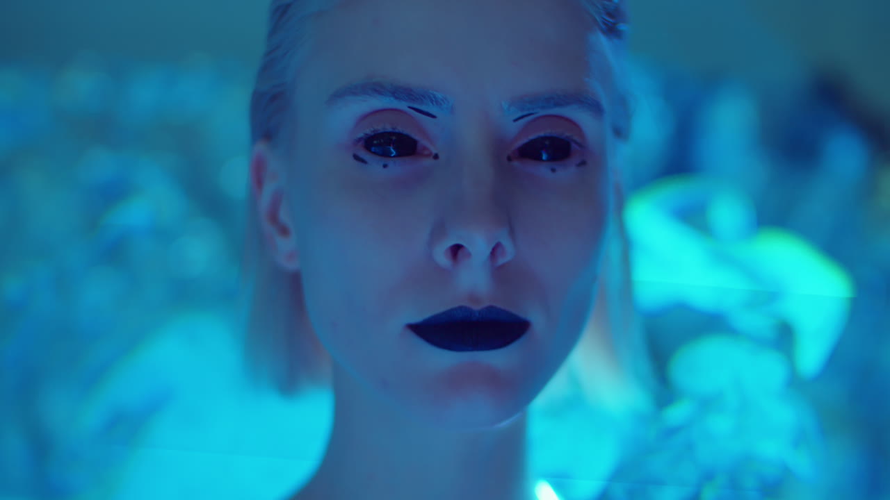 Model with Alien Makeup Posing in Laser Light