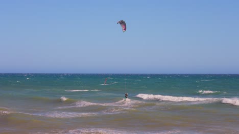 kite surfer crossing the waves