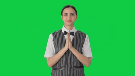 happy indian woman waiter welcoming customers green screen