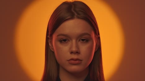 elegant portrait of a woman with dramatic lighting and expression the woman looks to the side with her head resting on her hand in dramatic lighting that perfectly emphasizes her facial expressions and features