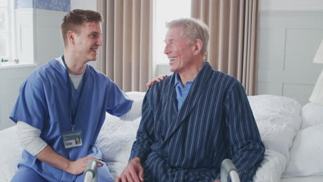 male doctor making home visit to senior man for medical check