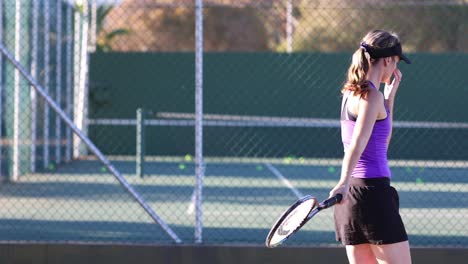 Close-up-footage-of-a-female-tennis-player-playing-tennis-on-a-tennis-court