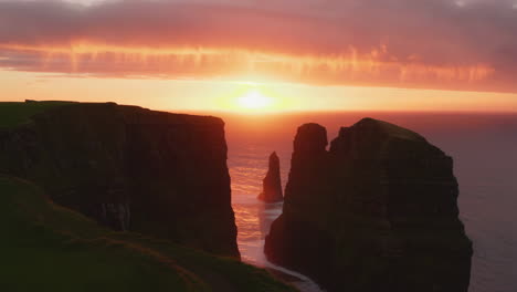 dramatic sunset over majestic sea cliffs and ocean